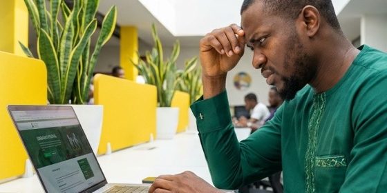 Man looking at his PC worried over his 214 (b) visa rejection